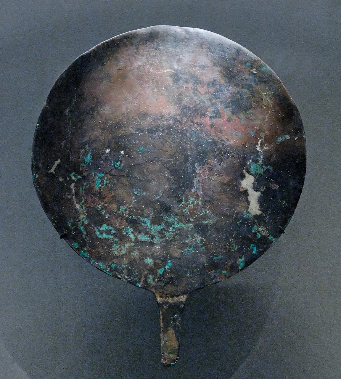 (1) A bronze mirror from a museum collection